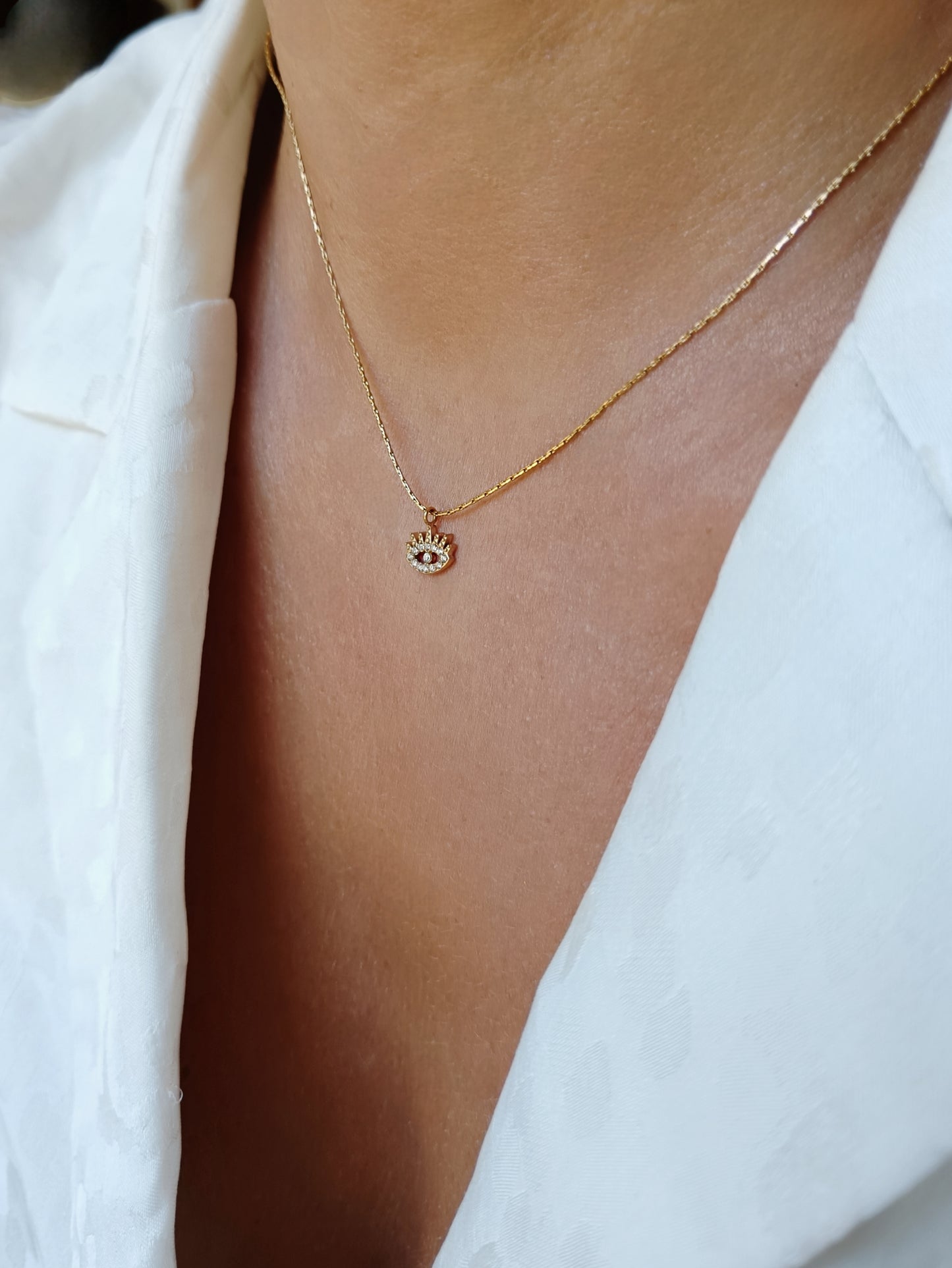 Collier œil strass en acier inoxydable doré