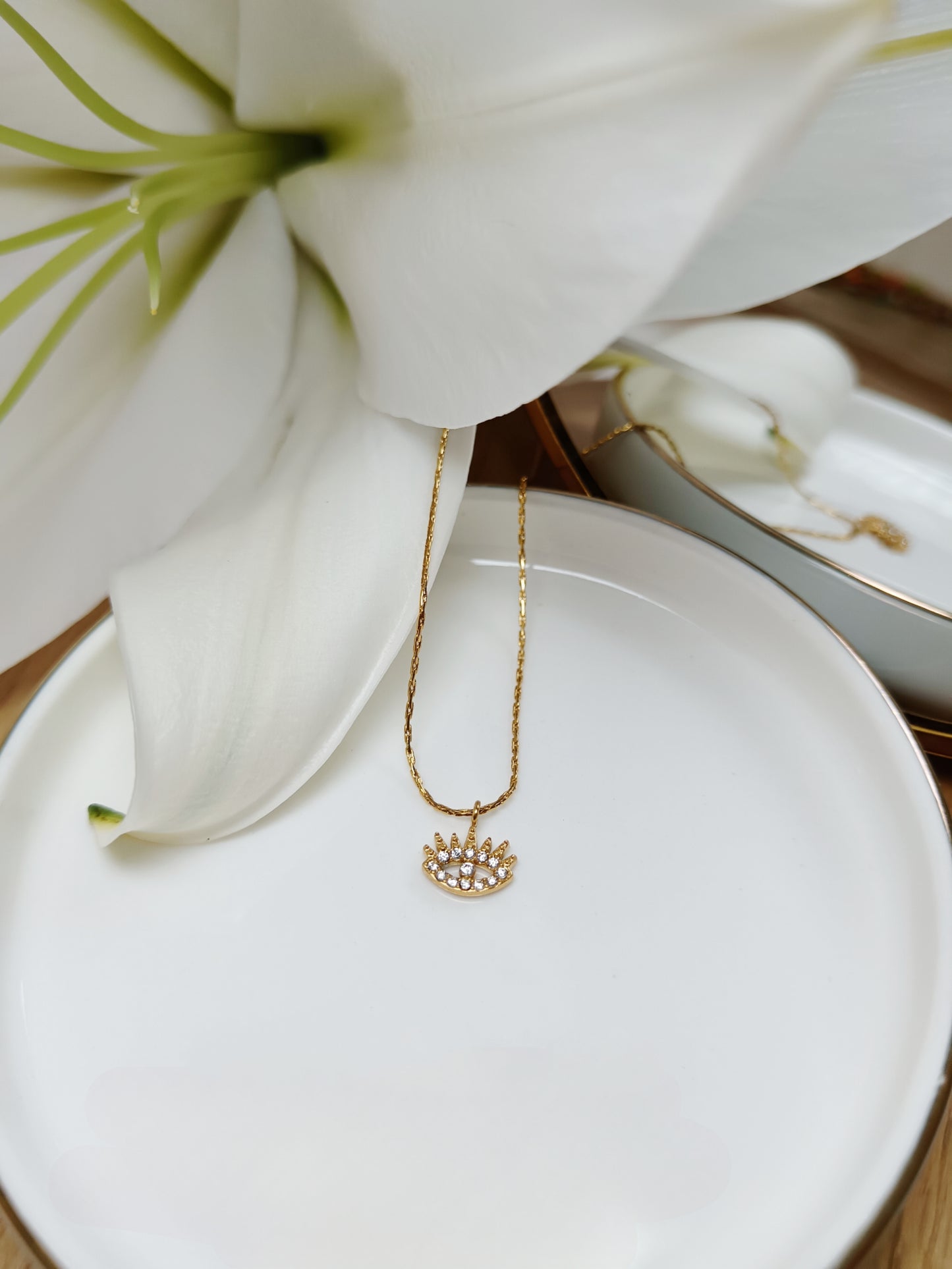 Collier œil strass en acier inoxydable doré