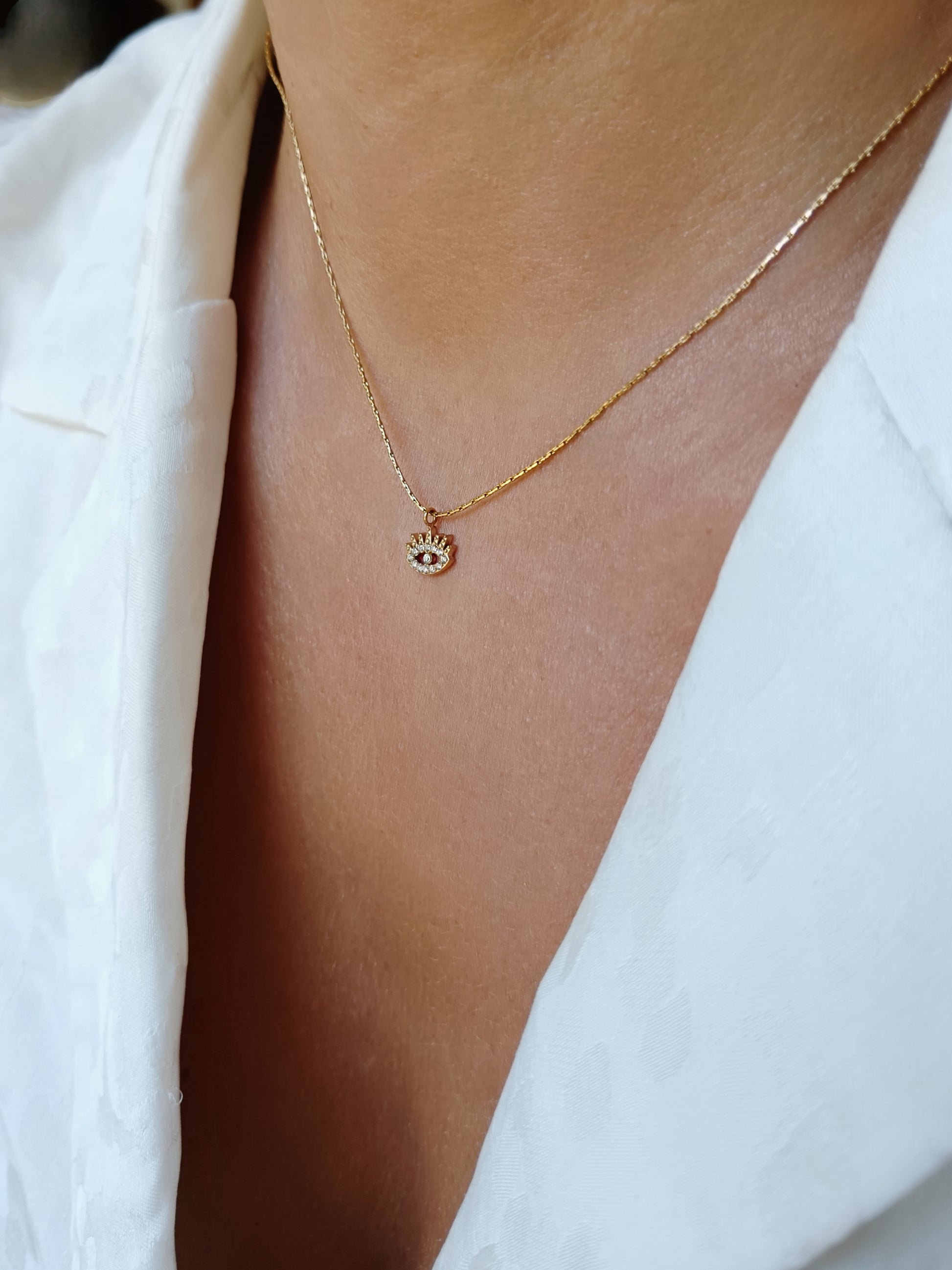 Collier œil strass en acier inoxydable doré